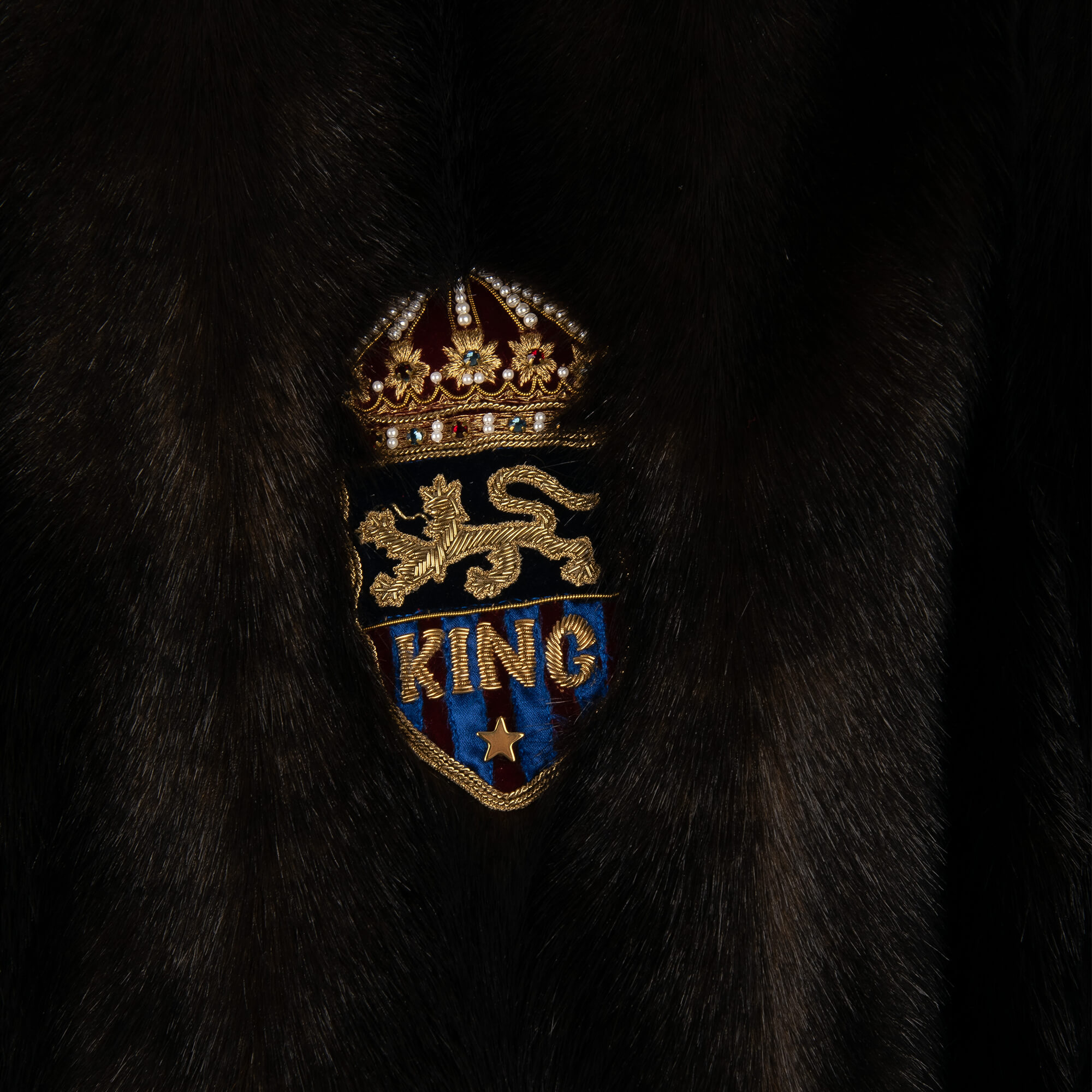 Stuffed Fake Fur bomber jacket with King and Crown embroidery in front and knit details by DOLCE & GABBANA
