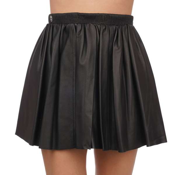 Mini leather skirt with skull, gun, dollar, heart, star print and crystal metal skull in black by PHILIPP PLEIN