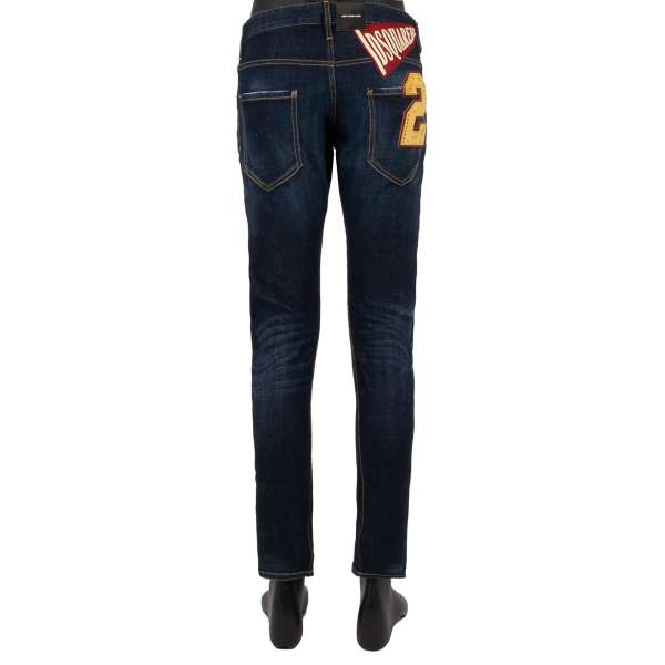 Distressed SKINNY DAN JEAN slim fit 5-pockets Jeans with Maple Logo patch  and paint splashes in blue by DSQUARED2