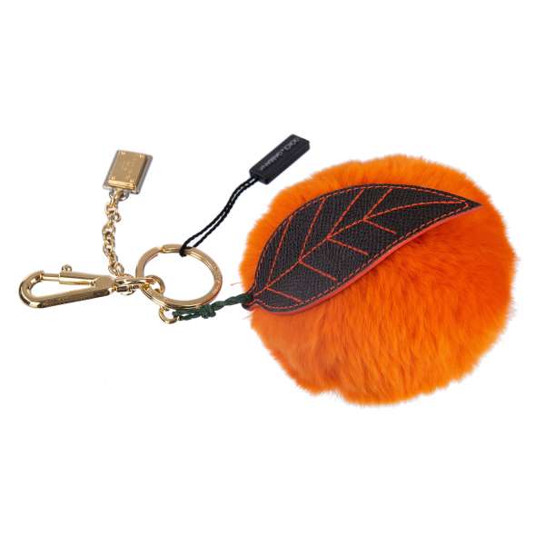 Key Chain / Bag Charm made of fur and brass embellished with DG logo plate in orange and gold by DOLCE & GABBANA