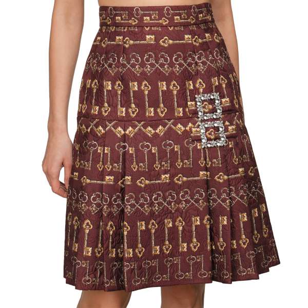 Keys printed pleated silk jacquard A-Line skirt with a crystals brooch by DOLCE & GABBANA