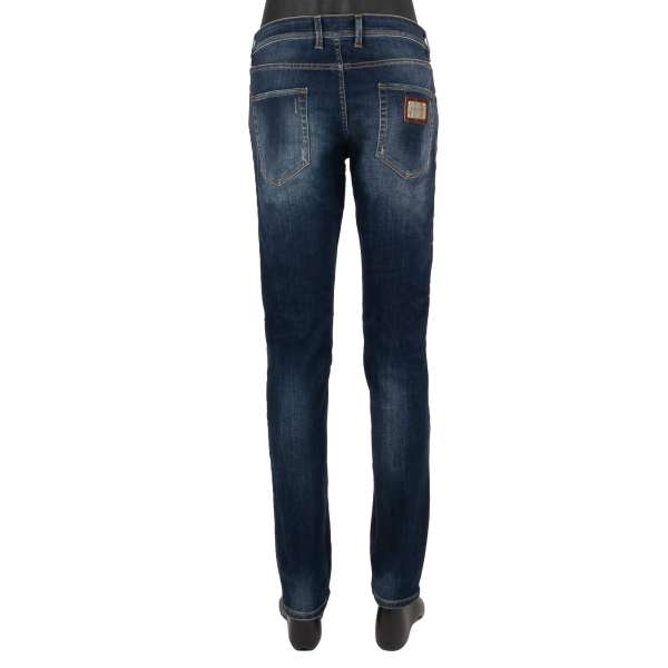 Distressed 5-pockets Jeans Slim Fit with golden metal logo plate in blue by DOLCE & GABBANA
