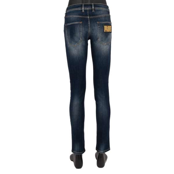 Distressed 5-pockets Jeans Slim Fit with golden metal logo plate in blue by DOLCE & GABBANA