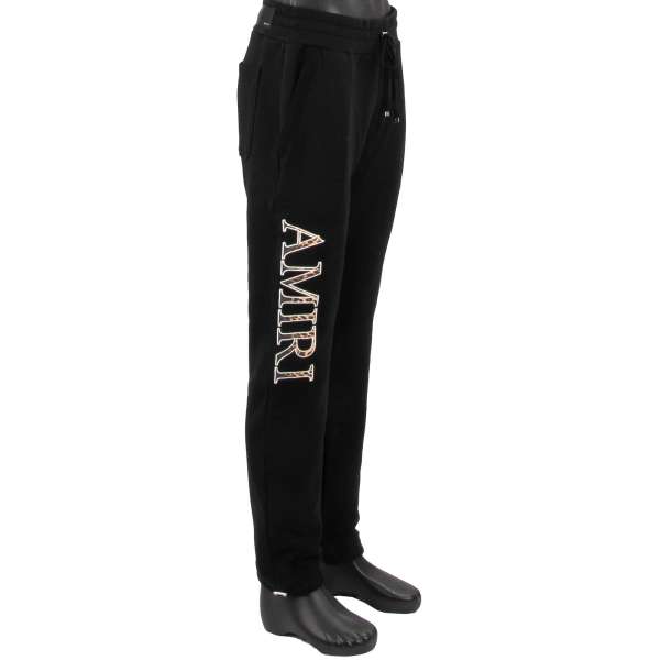 Sweatpants/ Jogger Hoser mit besticktem Leopard Logo und Taschen mit Reißverschluss in Schwarz von AMIRI
