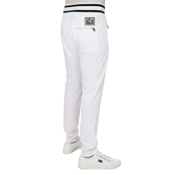 Light Joggings Pants with DNA Milano DG logo patch, elastic waist and zipped pockets in white by DOLCE & GABBANA