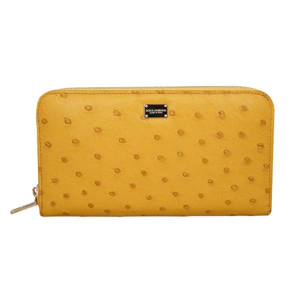 Ostrich Leather Zip-Around wallet with logo plate in yellow by DOLCE & GABBANA