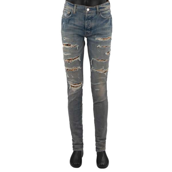 5-pockets Skinny Distressed Stretch Leopard Thrasher Jeans in Indigo Clay with Leather Fur Inserts by AMIRI
