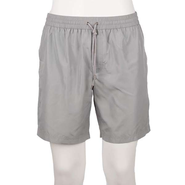 Swim shorts / Board shorts with pockets, built-in-brief and logo by DOLCE & GABBANA Beachwear