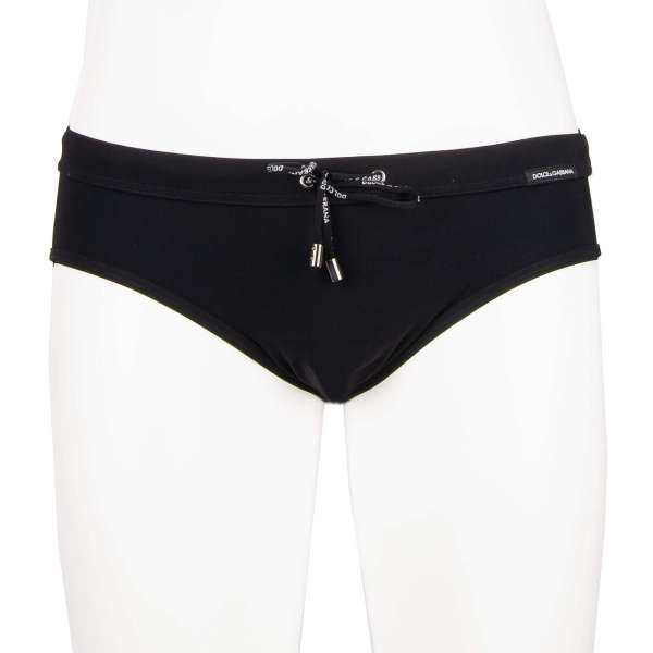 Elastic Swim / Brief trunks with logo in black by DOLCE & GABBANA Beachwear