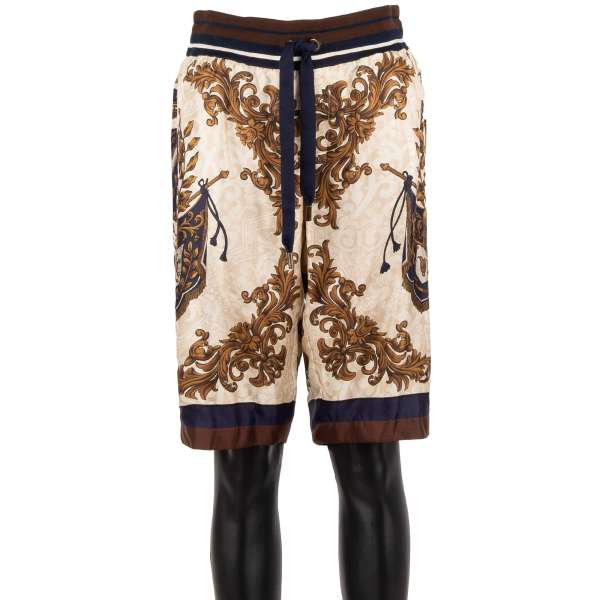 Lined Silk Bermuda Shorts with heraldry and logo print and zipped pockets by DOLCE & GABBANA