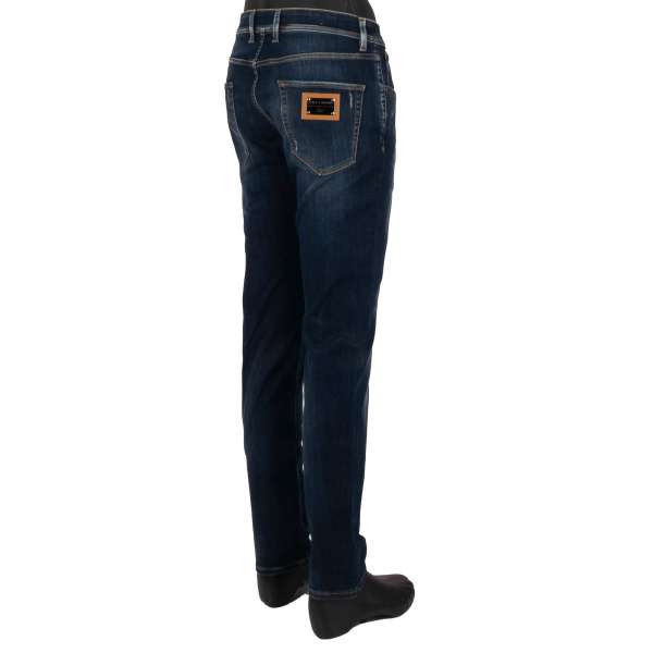 Distressed 5-pockets Jeans Slim Fit with golden metal logo plate in blue by DOLCE & GABBANA